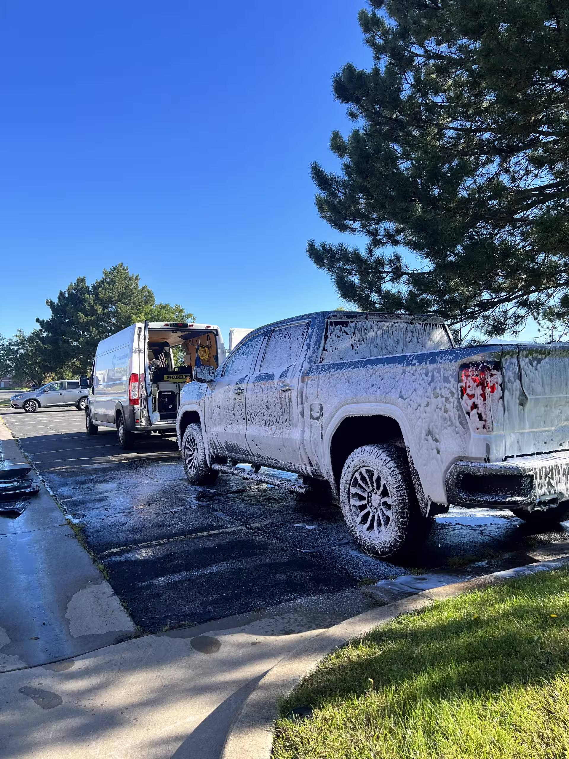 GL Car Wash team detailing a vehicle
